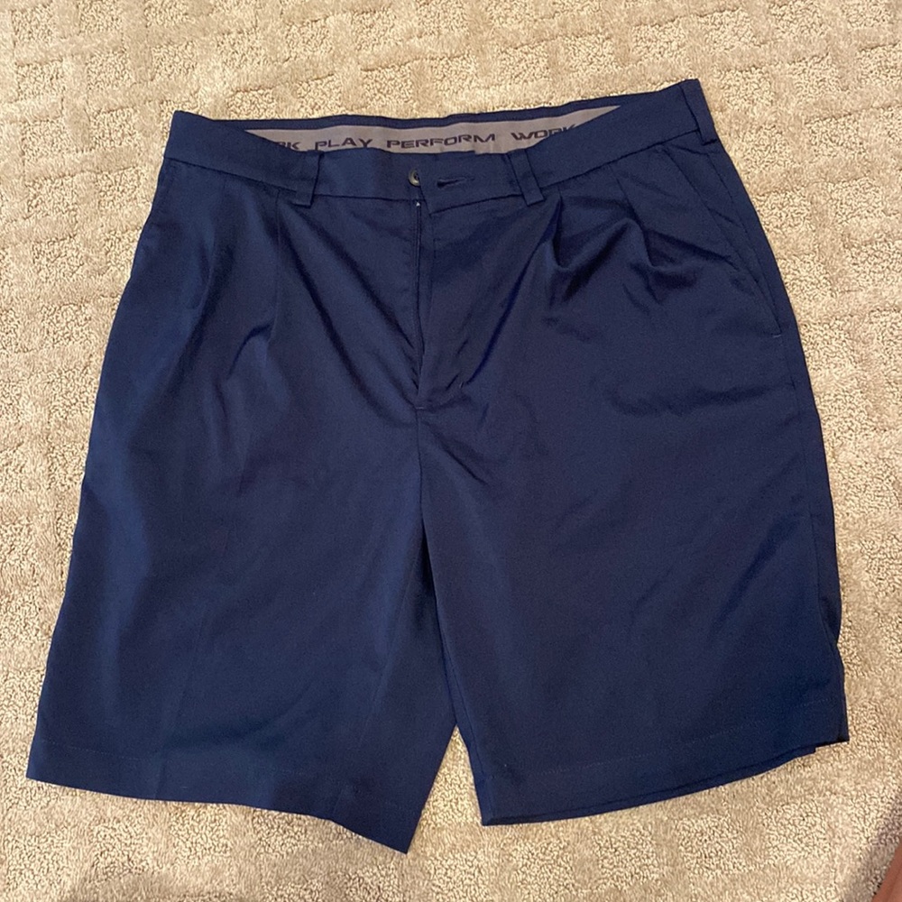 Men’s performance golf shorts and navy blue size 33. 99% polyester